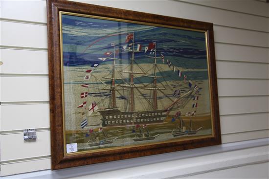 A Victorian sailors woolwork picture, 21 x 29in., later burr wood frame